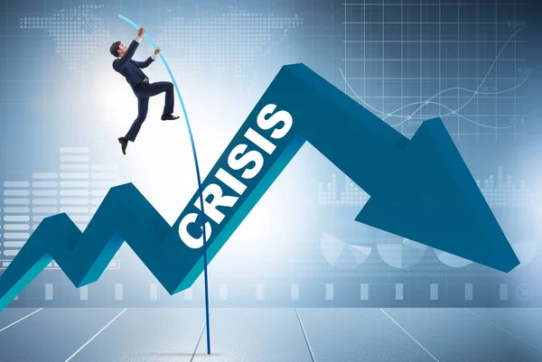 Бизнесмен прыгает с шестом над кризисом в бизнес-концепции — стоковое фото