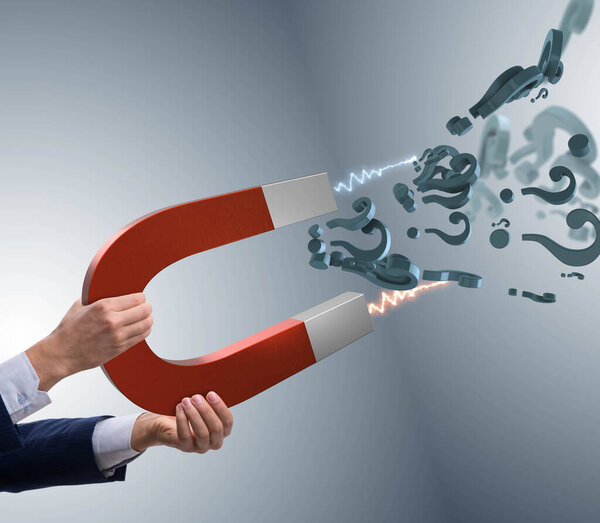 Бизнесмен ловит вопросы на подковообразном магните