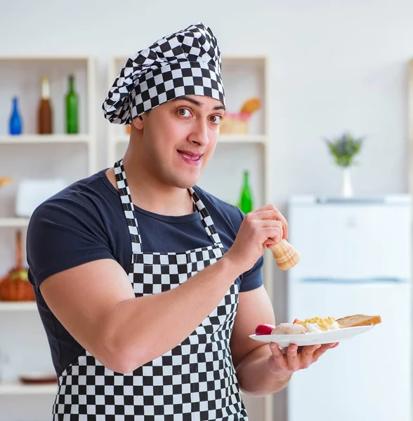 Chef cook cooking a meal breakfast dinner in the kitchen — Stock Image Chef cook cooking a meal breakfast dinner in the kitchen Royalty Free Stock Images