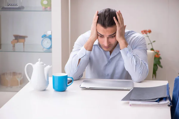 Young male employee working from the house — Stock Photo, Image