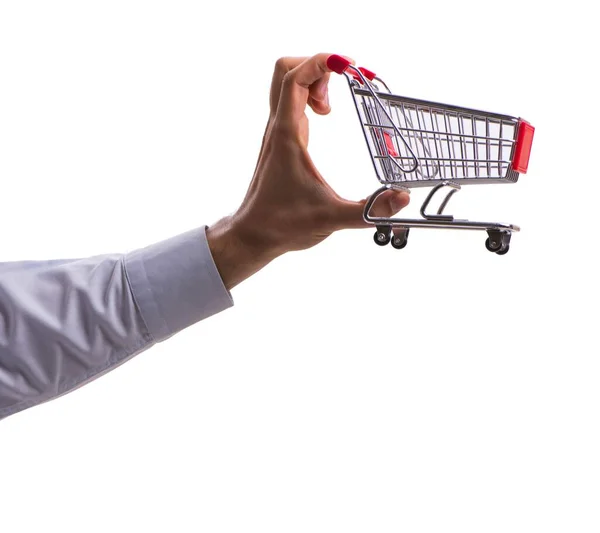 Mão segurando carrinho de compras isolado no branco — Fotografia de Stock