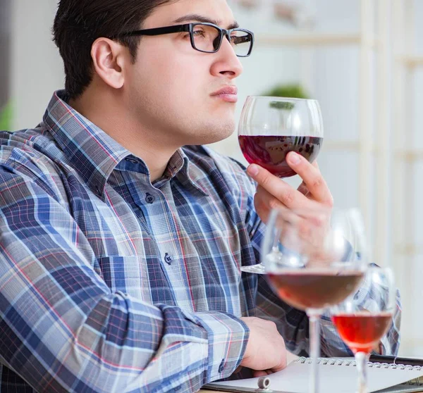 Professional sommelier tasting red wine — Stock Photo, Image