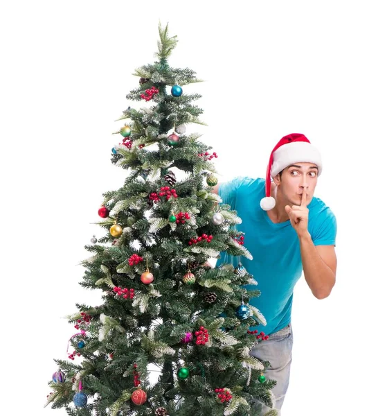 Hombre joven decorando árbol de Navidad aislado en blanco —  Fotos de Stock