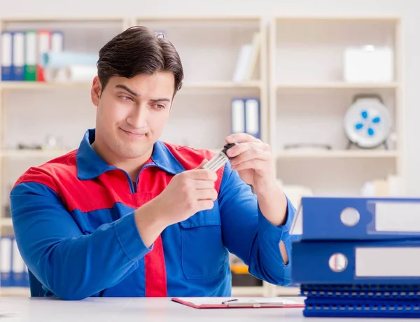 Worker in uniform working on project — Stock Photo, Image