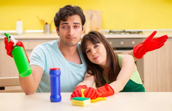 Young couple working at kitchen — Stock Photo, Image