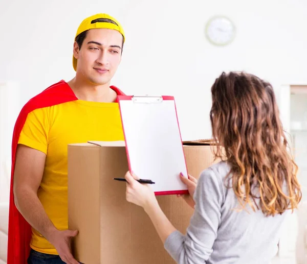 Superhero delivery guy with box