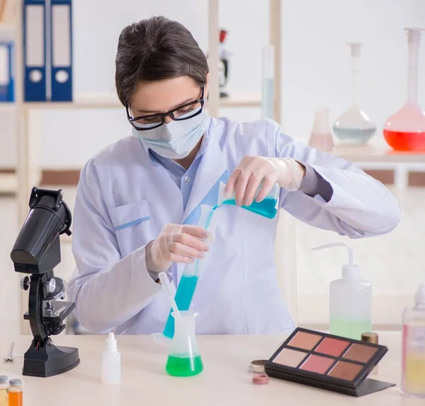 Lab chemist checking beauty and make-up products