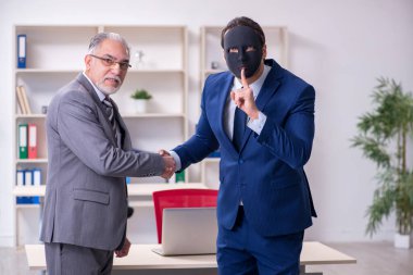 Two businessmen wearing masks during negotiations clipart