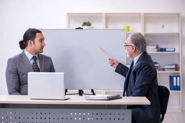 Old and young businessmen in business meeting concept — Stock Photo, Image