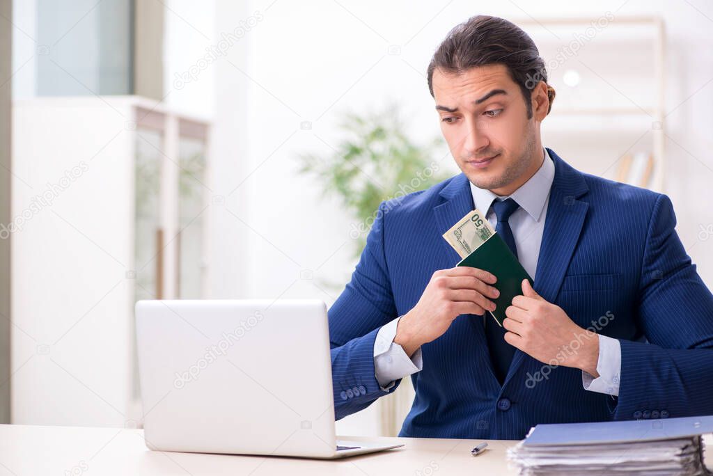 Young man receiving bribery for visa approval