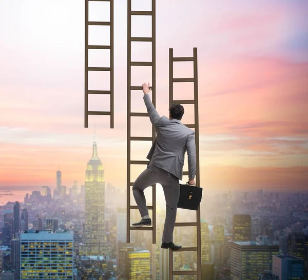 Businessman climbing career ladder in business concept — Stock Photo, Image