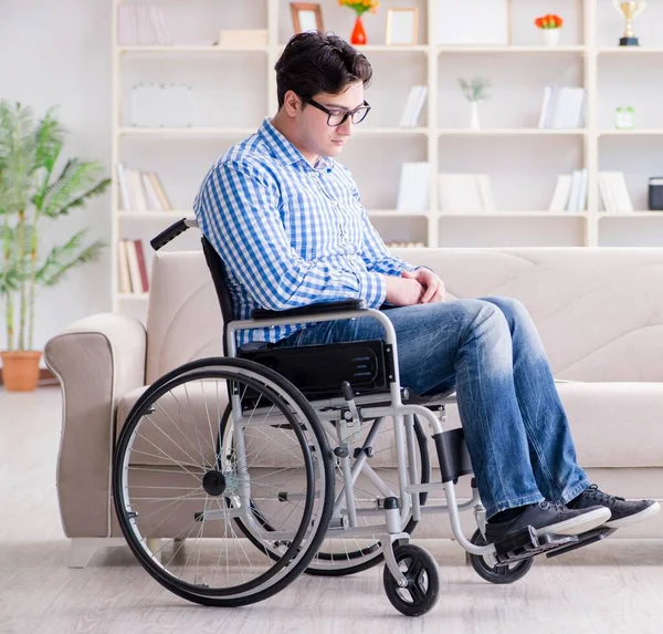 Young student on wheelchair in disability concept — Stock Photo, Image