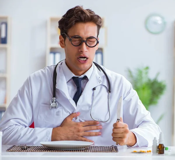 Mad crazy doctor preparing to eat rabbit — Stock Photo, Image