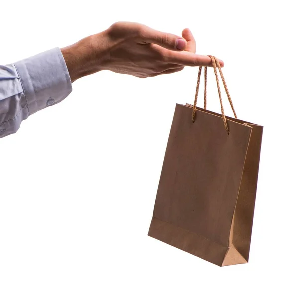 Hand holding shopping bags with christmas shopping on white back — Stock Photo, Image