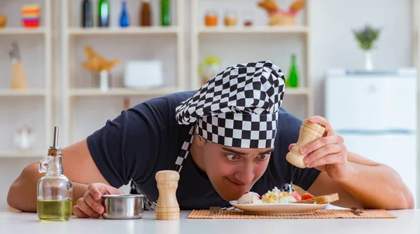 Chef cook cooking a meal breakfast dinner in the kitchen — Stock Image Chef cook cooking a meal breakfast dinner in the kitchen Royalty Free Stock Photos