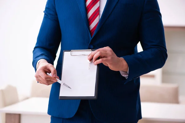 Handsome male realtor working indoors — Stock Photo, Image