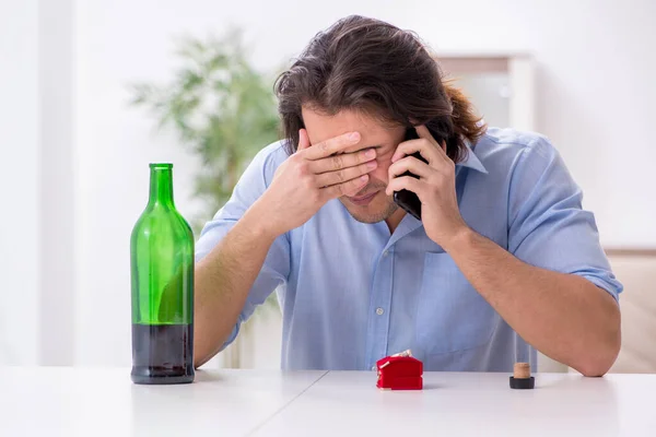 Young male alcoholic in unrequited love concept — Stock Photo, Image
