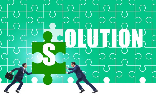 Solution concept with businessman solving jigsaw puzzle