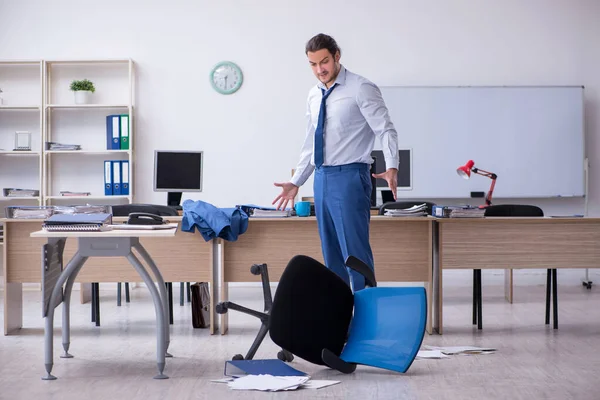 Young male employee unhappy with excessive work — Stock Photo, Image