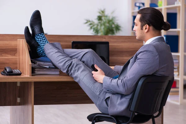 Young male employee working in the office — Stock Photo, Image