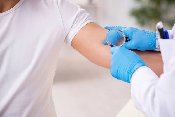 Young man visiting experienced doctor dermatologist — Stock Photo, Image