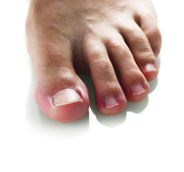 Close view of male foot isolated on white background