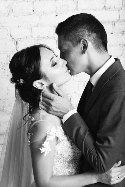 Black White View Groom Tenderly Touching Kissing Bride Brick Wall — Stock Photo, Image