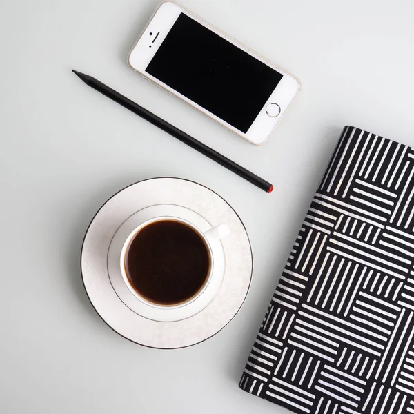 Office Desk Coffee Cup Smartphone Stationery — Free Stock Photo