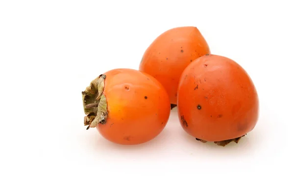 熟した甘い柿白い背景で隔離のグループ — ストック写真
