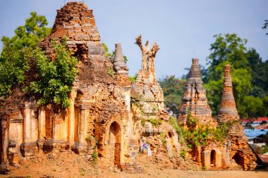 Shwe Indein pagoda with hundrets of centuries old stupas near lake Inle in Myanmar clipart