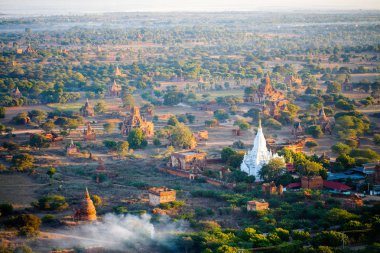 Stunning landscape view with thousands of historic buddhist pagodas and stupas in Bagan Myanmar clipart