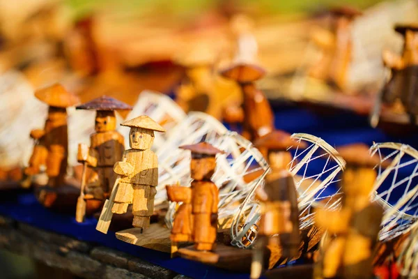 Wooden fishermen souvenirs at market on Inle lake in Myanmar