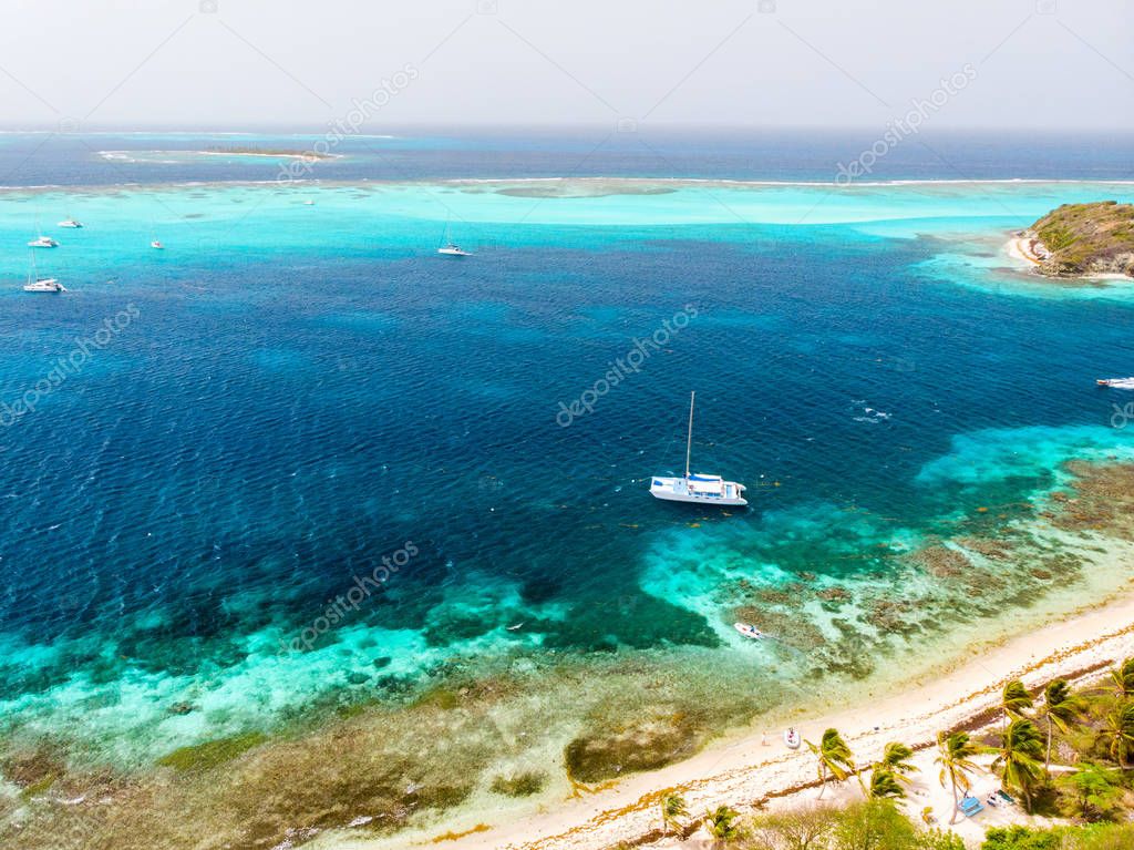 Aerial drone view of tropical islands and turquoise Caribbean sea of Tobago cays in St Vincent and Grenadines