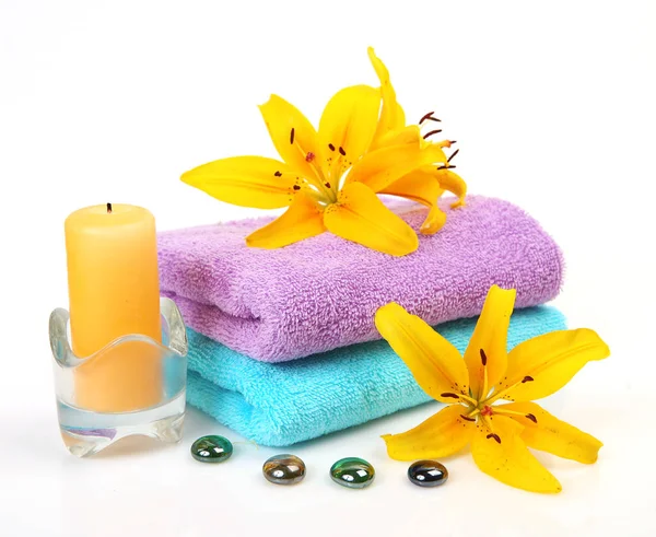 Cotton Towels Burning Candle Yellow Lilies White Background — Stock Photo, Image