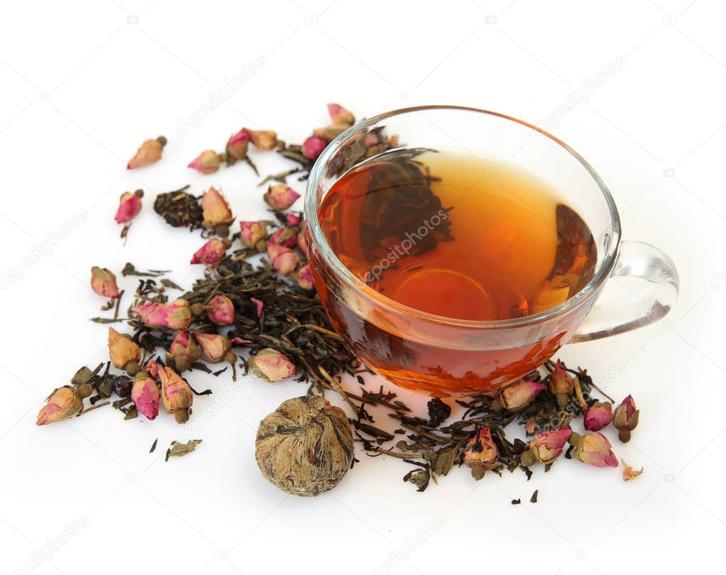 Tea in a mug and dry buds of rose roses