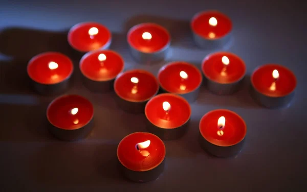 Red Wax Candles Burning Dark — Stock Photo, Image