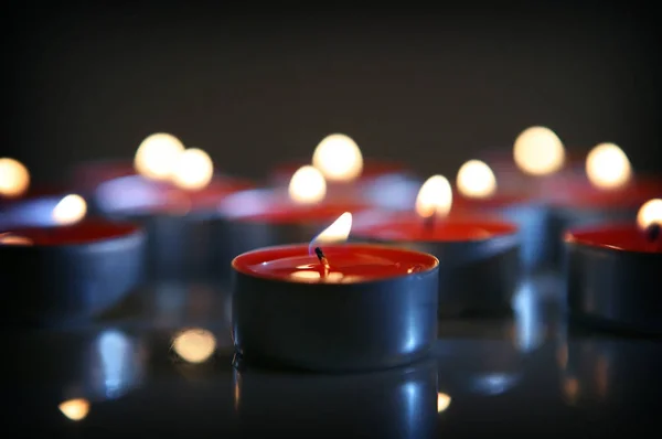 Red Wax Candles Burning Dark — Stock Photo, Image