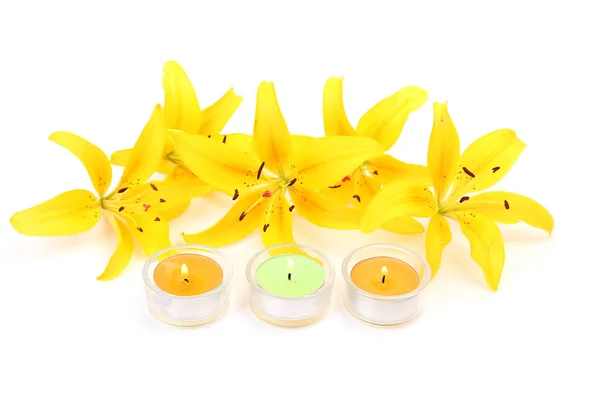 Yellow Lilies White Background Burning Candles — Stock Photo, Image