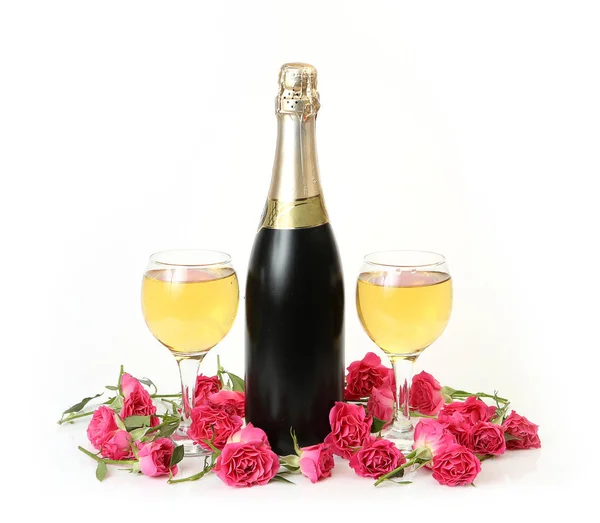 Champagne, pink roses on a white background — Stock Photo, Image