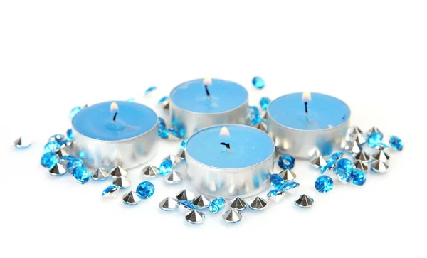 Blue shiny stones and burning candles — Stock Photo, Image