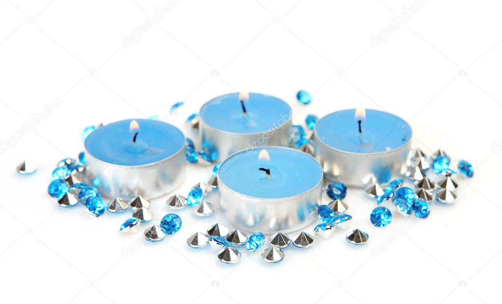 blue shiny stones and burning candles