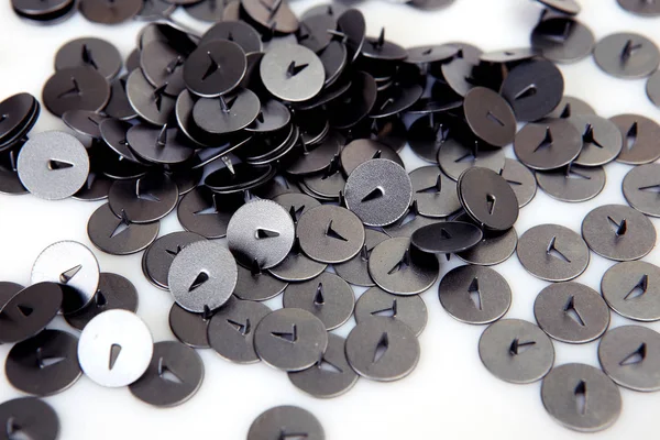 metal buttons with sharp ends