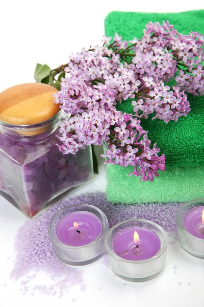 Cotton towels, lilac and candles — Stock Photo, Image