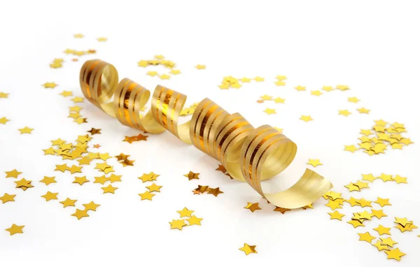 Streamer ribbon and golden confetti — Stock Photo, Image
