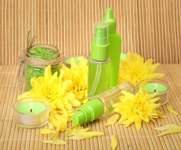 Body care items and yellow petals — Stock Photo, Image