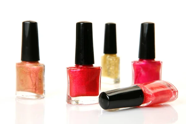 Bottles with colored nail polish on a white background — Stock Photo, Image