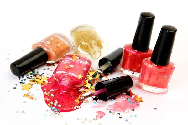 Pink nail polish and confetti — Stock Photo, Image