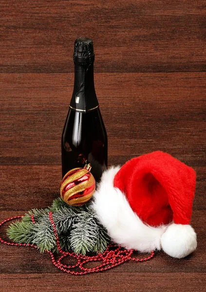 Bottle of champagne and christmas decoration — Stock Photo, Image