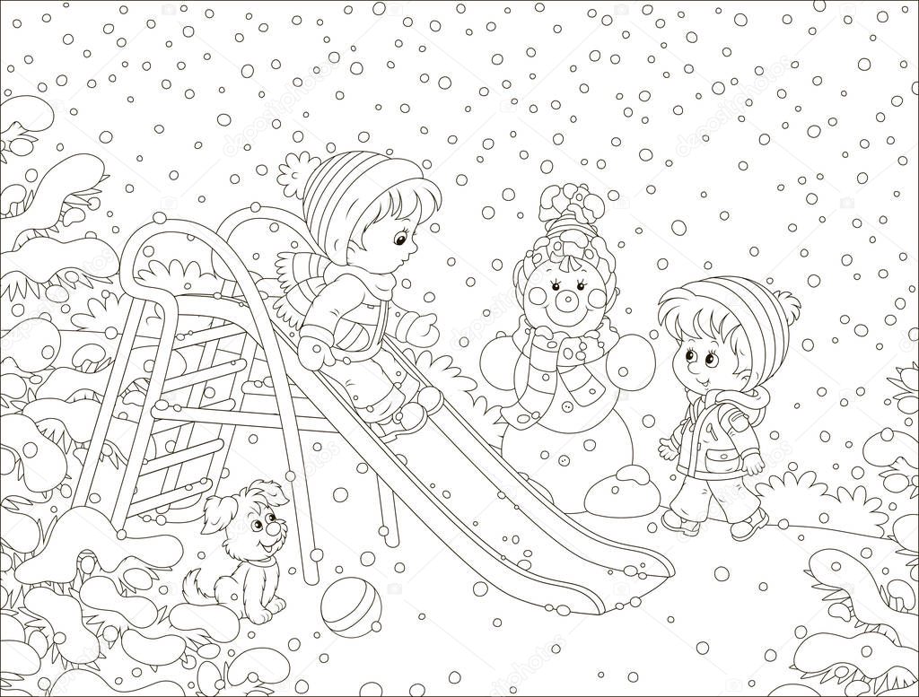 Kids playing on a toy slide on a snow-covered playground in a winter park, black and white vector illustration in a cartoon style for a coloring book