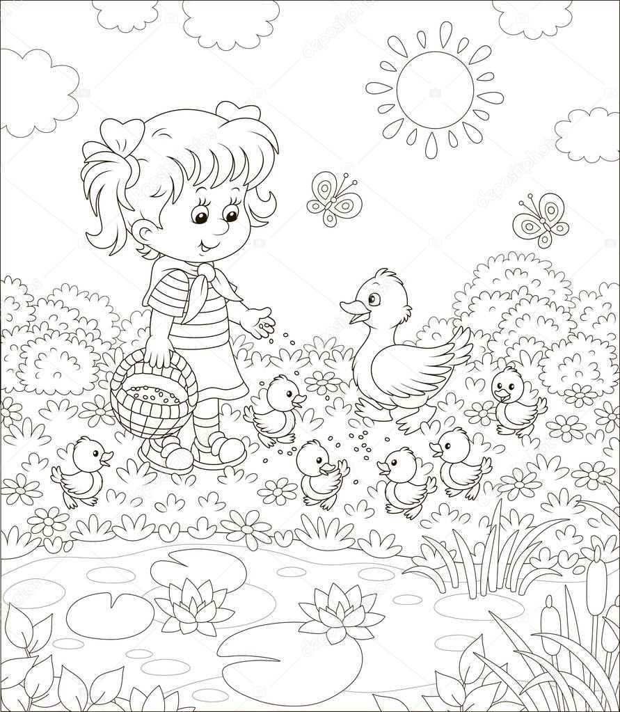 Little girl feeding a duck and small ducklings among flowers by a pond with water-lilies on a sunny summer day, black and white vector illustration in a cartoon style